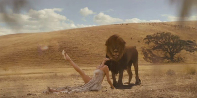 Taylor Swift, glamorizing colonialism, with lion.